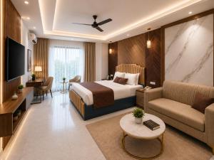 a hotel room with a bed and a couch at Hotel Luxury Stay Igi Airport Delhi in New Delhi