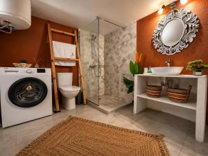 a bathroom with a washing machine and a sink at Katoi traditional house in Éxo Khóra +37 photos