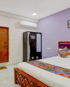 a bedroom with a bed in a room at Embassy Gate Residency - opp US Embassy in Chennai