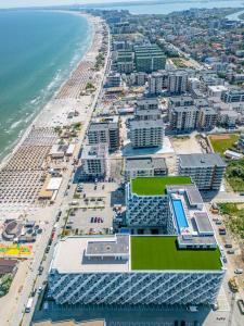 an aerial view of the beach and buildings at Vogue Sunrise View in Infinity Pool & Spa Resort in Mamaia Sat/Năvodari +50 photos