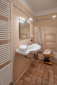 a bathroom with a sink and a mirror at Eremo della Gasprina in La Morra +30 photos