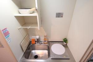 a small bathroom with a sink and a toilet at LUANA in KICHIJOJI in Musashino +62 photos