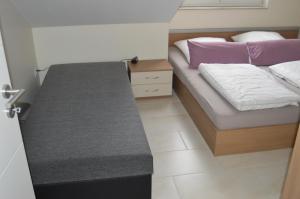 a small bedroom with a bed and a desk at Apartment Meerfeld in Duisburg +55 photos