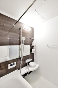 a bathroom with a shower and a toilet in it at Room 701 Large 3LDK 98sqm Near Namba Big Balcony Ideal for Groups and Long Stay in Osaka +48 photos