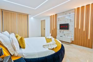 a bedroom with a bed with a clock on the wall at Villa 33 Ultra Lux High-End in Tangier