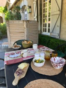 a table with plates of food on top of it at Maison Thoumieu in Azereix