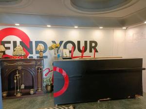 a store with a large sign on a wall at Hotel Mount View in Shimla