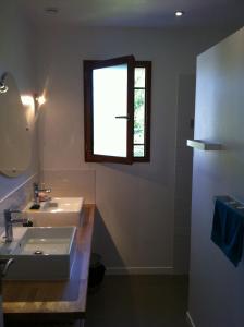 a bathroom with a sink and a window at chateaugite in Pontlevoy