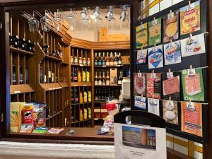 a store with a display of bottles of wine at HOTEL DIANA apartments in Prague