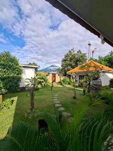 a view of a yard with a house at Devarastra Villa #3 in Amed