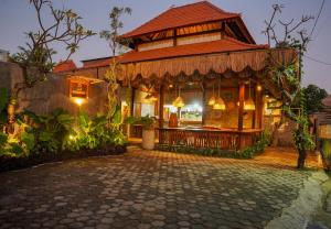 a house with a shop with a roof at Bi Bi Bliss Ubud Villa in Ubud
