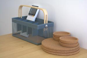 a blue basket with a cell phone in it on a table at Dark Sky Retreat in Lake Tekapo