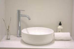 a white sink with a faucet in a bathroom at Dark Sky Retreat in Lake Tekapo +11 photos