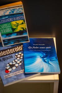 three pamphlets sitting on top of a table at Ánemos b&b in Termoli +45 photos