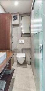 a bathroom with a toilet and a sink at Speyer Ferienwohnung Apartment 5 in Speyer +8 photos