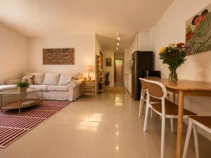 a living room with a couch and a table at Phangan Chalet Bungalows in Chaloklum