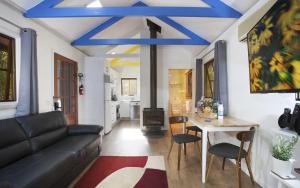 a living room with a couch and a table at Seaside Retreat in Mitchells Island
