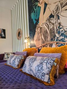 a bedroom with two beds and a large mural at La Fraizière in Arnaville +34 photos