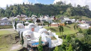 an aerial view of a village with white houses at Glamping Grand Mazaya Private Pool in Bandung