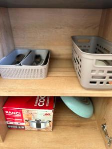 two plastic dishes are sitting on a shelf at Glamping Grand Mazaya Private Pool in Bandung