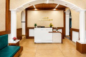a lobby with a waiting area with a reception desk at Lake Residency Ooty in Ooty
