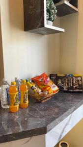 a counter top with snacks and chips on it at Tehzeeb living in Lucknow