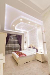 a bedroom with a large bed and a large mirror at CRYSTAL GUEST HOUSE in Samarkand