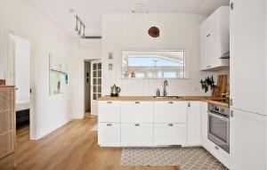 a white kitchen with a sink and a window at 3 Bedroom Cozy Home In Haderslev in Haderslev