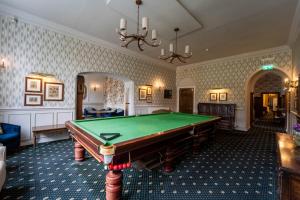 a billiard room with a pool table in it at Grinkle Park Hotel in Loftus