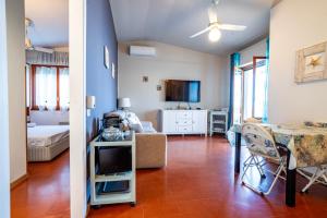 a living room with a couch and a table at Moneglia - Le Case di Bart in Moneglia