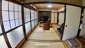 a room with a view of a living room at 陽だまりハウス in Hiroshima