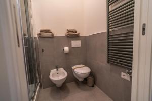 a bathroom with a toilet and a bidet at NOVELLA DEL MAR prima fila dal mare in Grottammare +26 photos