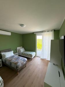 a bedroom with two beds and a large window at 88 Destination in Treviglio +20 photos