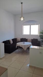 a living room with a couch and a table at Sidi Kankouch Bay in Tangier