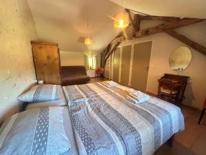 a bedroom with a bed and a piano in a room at B&B Angueur in Montrem