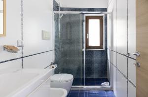 a bathroom with a toilet and a shower at Villa Serra d'Elci in Ascea +166 photos