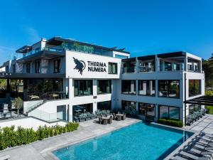 an image of a building with a swimming pool at THERMA NUMERA Mineral SPA & Longevity in Burgas +84 photos