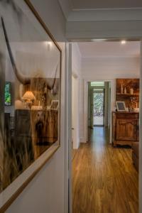a hallway of a home with a living room at Handleys Cottage in High Range