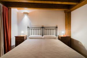 a bedroom with a large bed with two night stands at Tre Volte Belle - Salento Selection in Carpignano Salentino