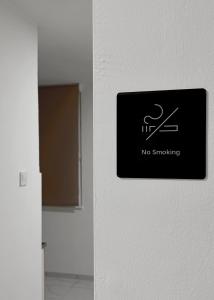 a no smoking sign on a door in a room at Apartman City 2 With 2 Bedrooms and Free Parking in Negotin