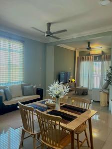 a living room with a table and a couch at LS homestay Ipoh in Chemor