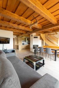 a living room with a couch and a table at Chata Michala in Dolný Kubín