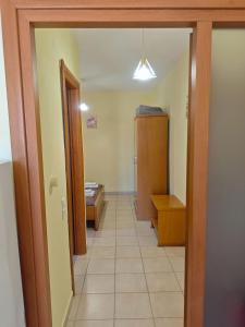 a hallway with a room with a bed and a door at Lavender Apartments in Skala Potamias +87 photos