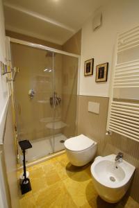 a bathroom with a shower and a toilet and a sink at Carlo Alberto B&B in Gavi +7 photos