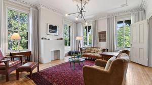 a living room with a couch and a table at River View by AvantStay in Germantown