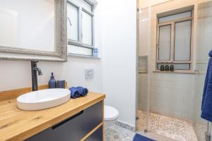 a bathroom with a sink and a shower at Me & U - הווילה שלי בכנרת in Tel Kazir +22 photos