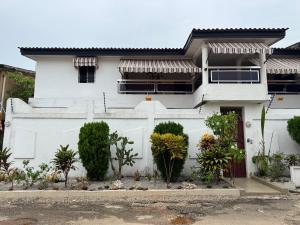 a white house with a white garage at Noble Villa in Abidjan