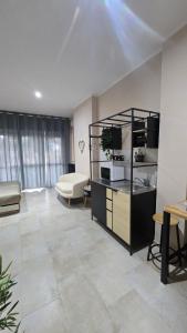 a living room with a couch and a table at B&B House Novara in Novara +42 photos