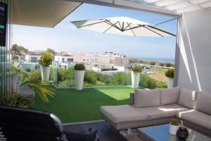 a living room with a couch and a large window at Luxury by the Blue in Vila Nova de Gaia