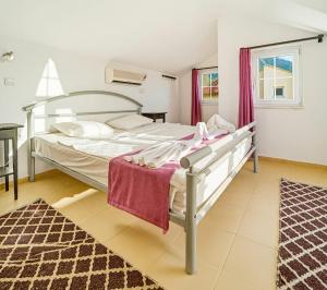 a bedroom with a bed in a room at Summerdays in the Med in Fethiye +19 photos